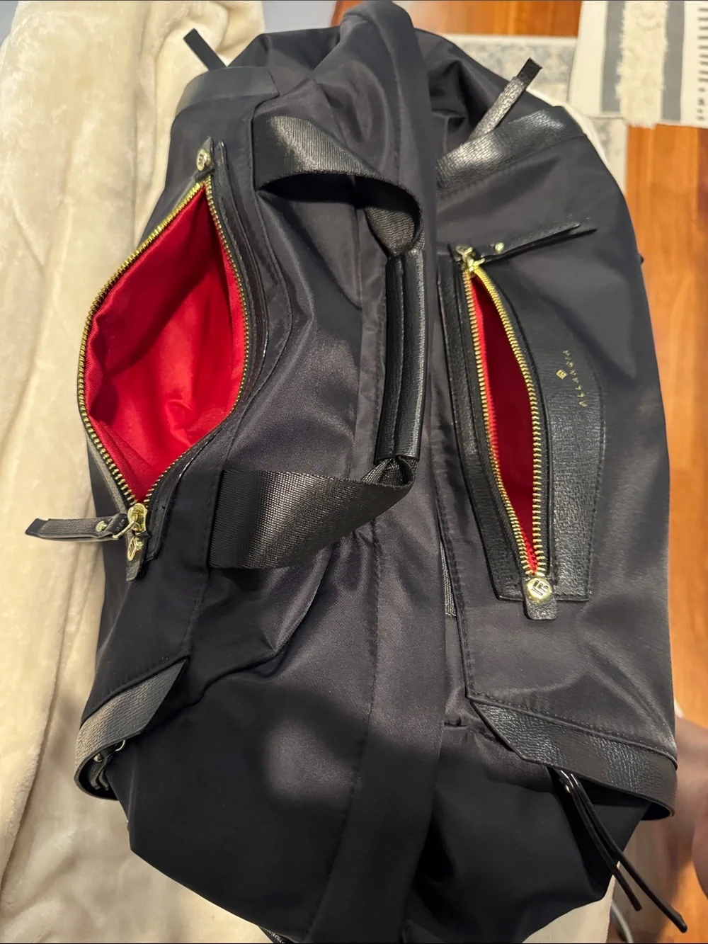 Allancia Peyton black nylon backpack featuring striking gold-tone hardware. NEW